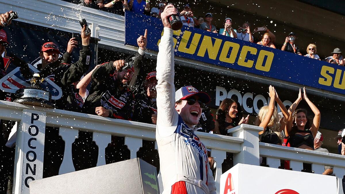NASCAR driver Ryan Blaney celebrates in Victory Lane after winning the NASCAR Cup race on Sunday at Pocono Raceway.
