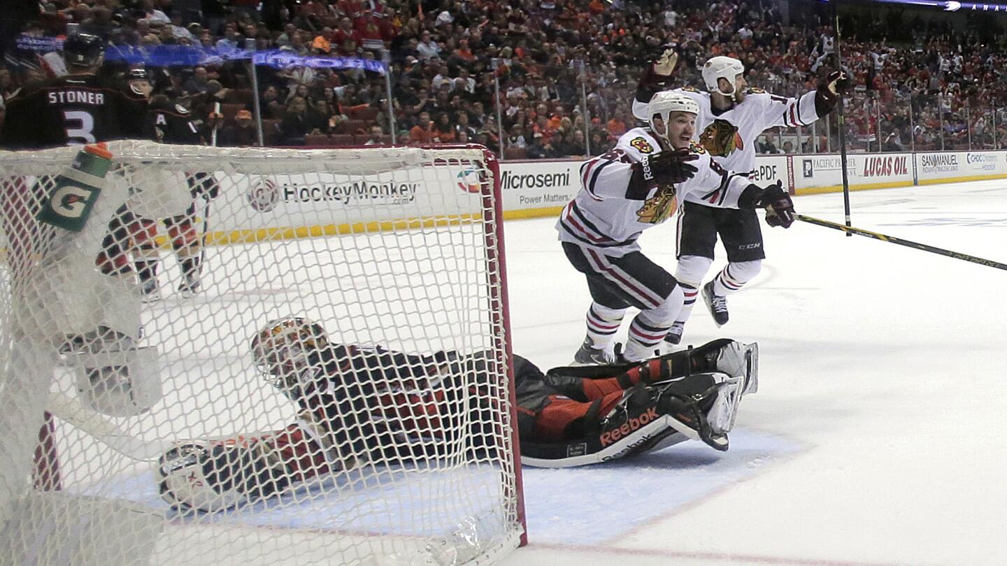 Chicago Blackhawks forward Andrew Shaw celebrates in front of Ducks goalie Frederik Andersen after Marcus Kruger (not pictured) scores winning goal in triple overtime of 3-2 victory in Game 2 of the Western Conference finals at Honda Center on May 19, 2015.