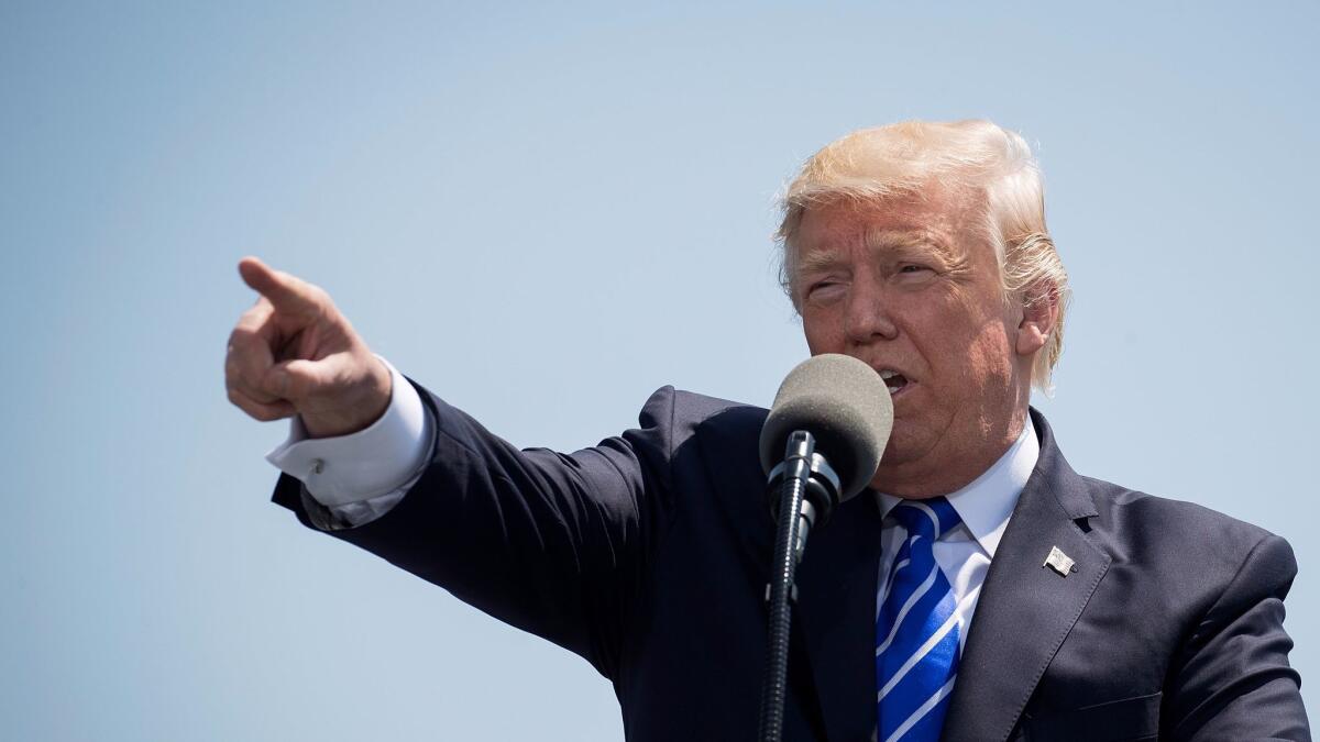 President Trump delivers the commencement address at the U.S. Coast Guard Academy in New London, Conn., on May 17.