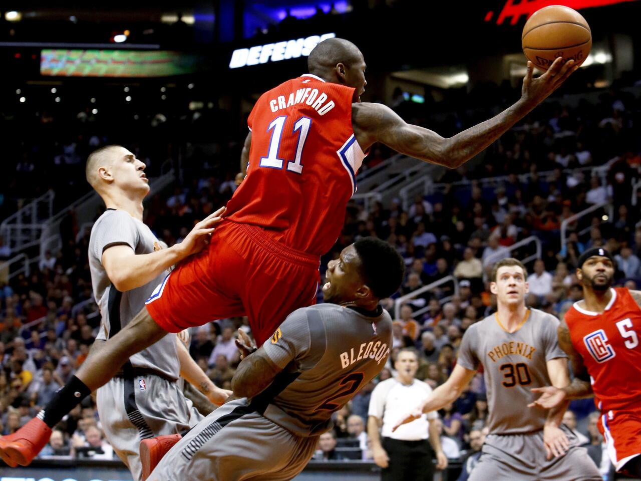 Suns guard Eric Bledsoe draws the offensive foul on Clippers guard Jamal Crawford in the second quarter.