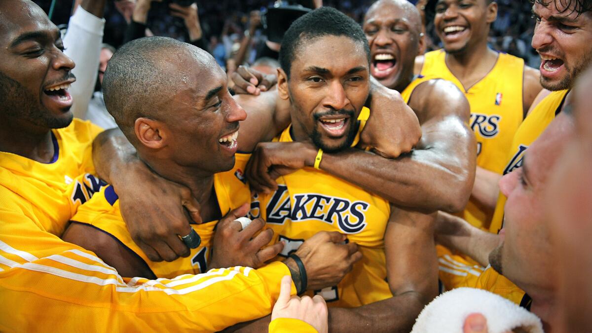 Metta World Peace, known then as Ron Artest, is congratulated by his Lakers teammates after making a game-winning shot against the Suns in the 2010 playoffs.