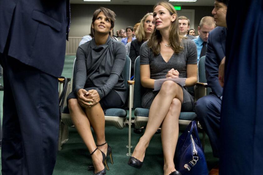 Actresses Halle Berry, left, and Jennifer Garner sit before they testify at the state Capitol Aug. 13 in favor of a bill aimed at restricting paparazzi access to children.