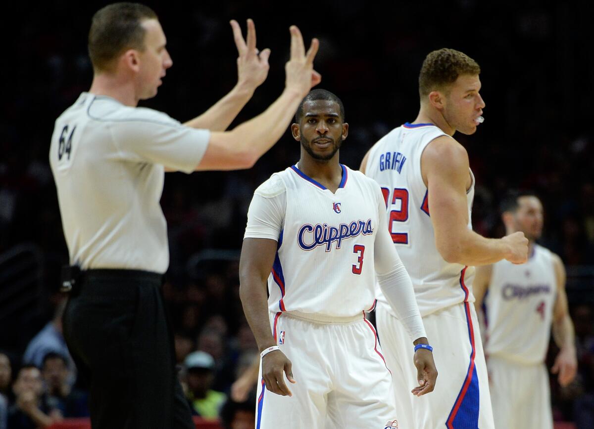 Clippers point guard Chris Paul (3) watches referee Justin Van Duyne call a technical foul on forward Blake Griffin (32) in the fourth quarter.