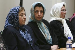 FILE - In this Aug. 27, 2007 file photo, prominent Iranian human rights activist Narges Mohammadi, center, sits next to Iranian Nobel Peace Prize laureate Shirin Ebadi, left, while attending a meeting on women's rights in Tehran, Iran. Mohammadi who campaigned against the death penalty, was released from prison Iranian media reported Thursday, Oct. 8, 2020. The semiofficial ISNA news agency quoted judiciary official Sadegh Niaraki as saying that Mohammadi was freed late Wednesday after serving 8 1/2 years in prison. (AP Photo/Vahid Salemi, File)