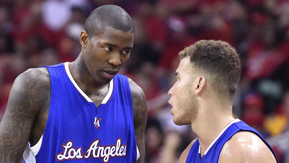 Clippers guard Jamal Crawford, left, speaks with teammate Blake Griffin during the Clippers' loss to the Houston Rockets in Game 5 of the Western Conference semifinals on May 12, 2015.