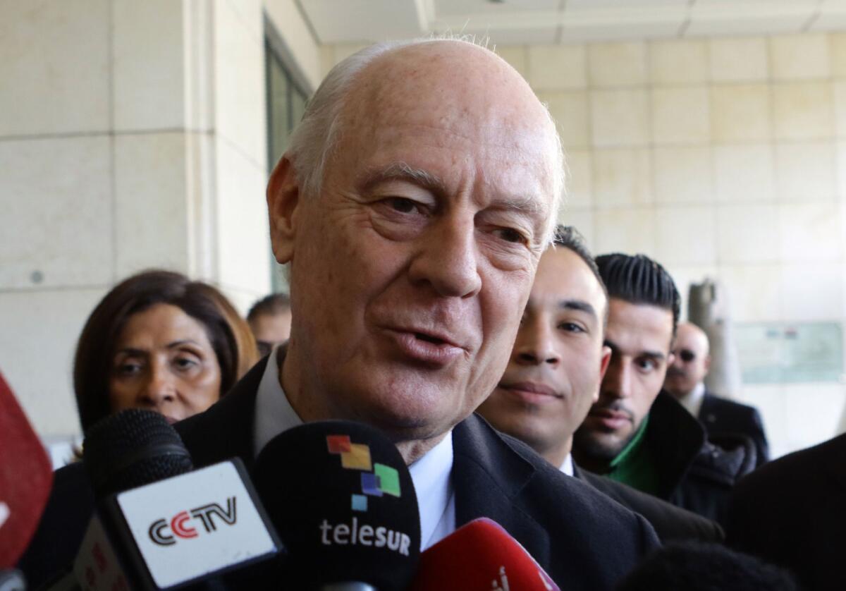 The U.N. envoy to Syria, Staffan de Mistura, speaks to reporters as he heads for meetings in the Syrian capital, Damascus, on Tuesday.