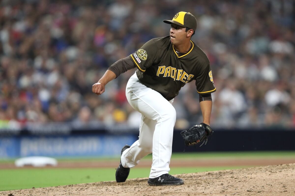 SAN DIEGO, CALIFORNIA - JULY 12: Andres Munoz #54 of the San Diego Padres pitches during the sixth inning of a game against the Atlanta Braves at PETCO Park on July 12, 2019 in San Diego, California. (Photo by Sean M. Haffey/Getty Images) ** OUTS - ELSENT, FPG, CM - OUTS * NM, PH, VA if sourced by CT, LA or MoD **