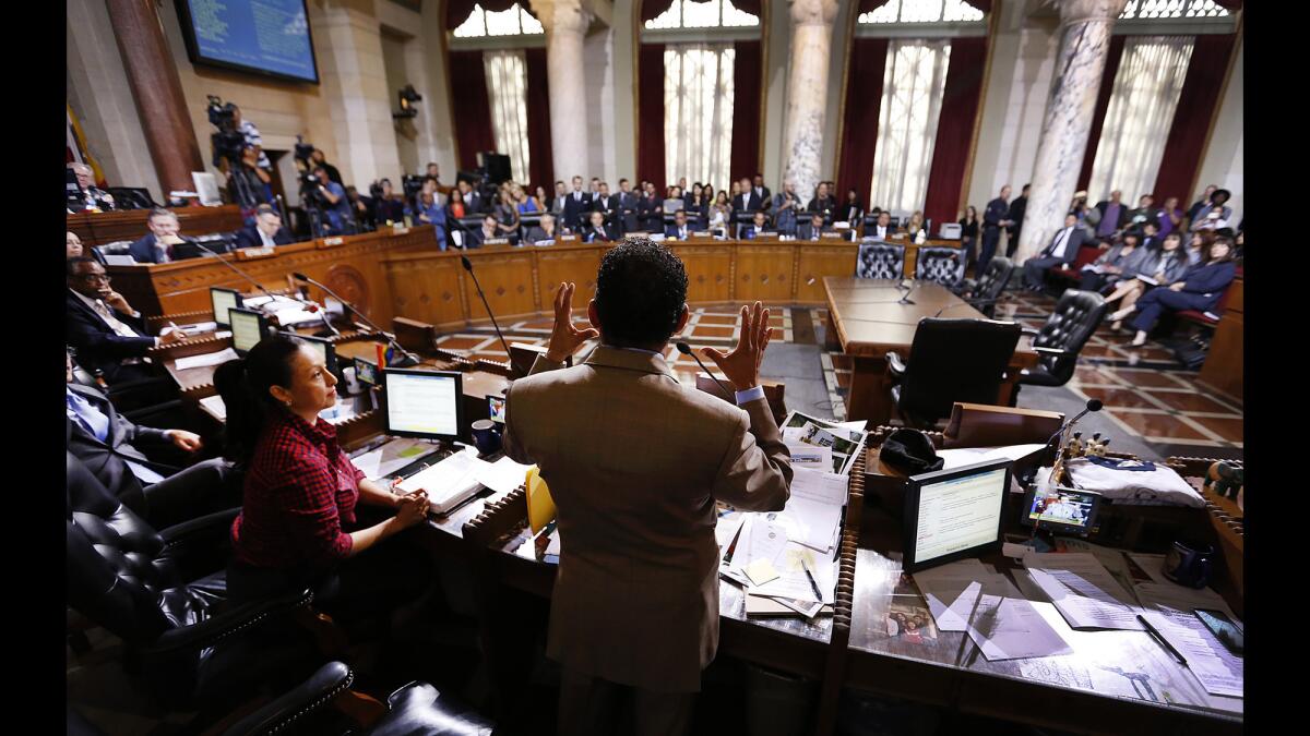Los Angeles City Council President Herb Wesson, center, speaks at Los Angeles City Hall before the City Council voted on an ordinance to raise the minimum wage in Los Angeles to $15 per hour by 2020.