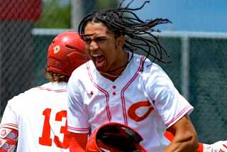 Freshman Anthony Murphy of Corona celebrates a walk-off win over top-seeded Notre Dame on Friday.