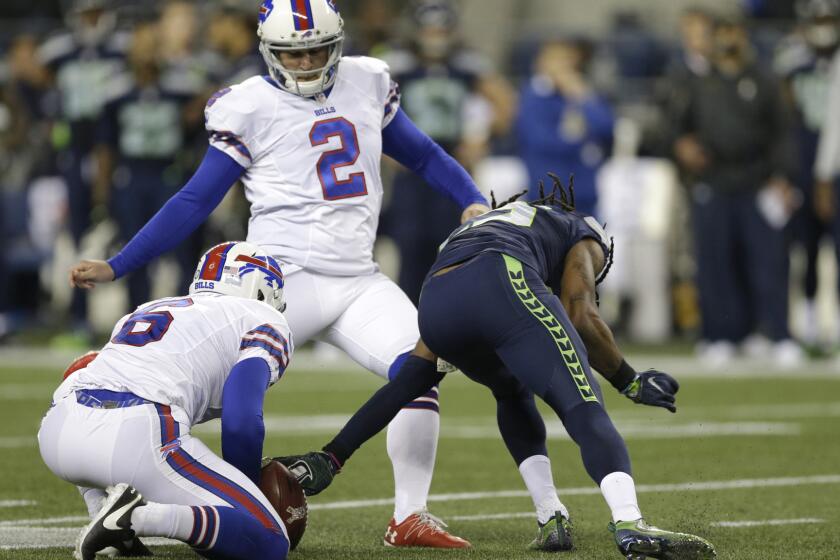 Seahawks cornerback Richard Sherman, right, blocks a field-goal attempt by Bills kicker Dan Carpenter (2) on a play after the whistle during their game last week.
