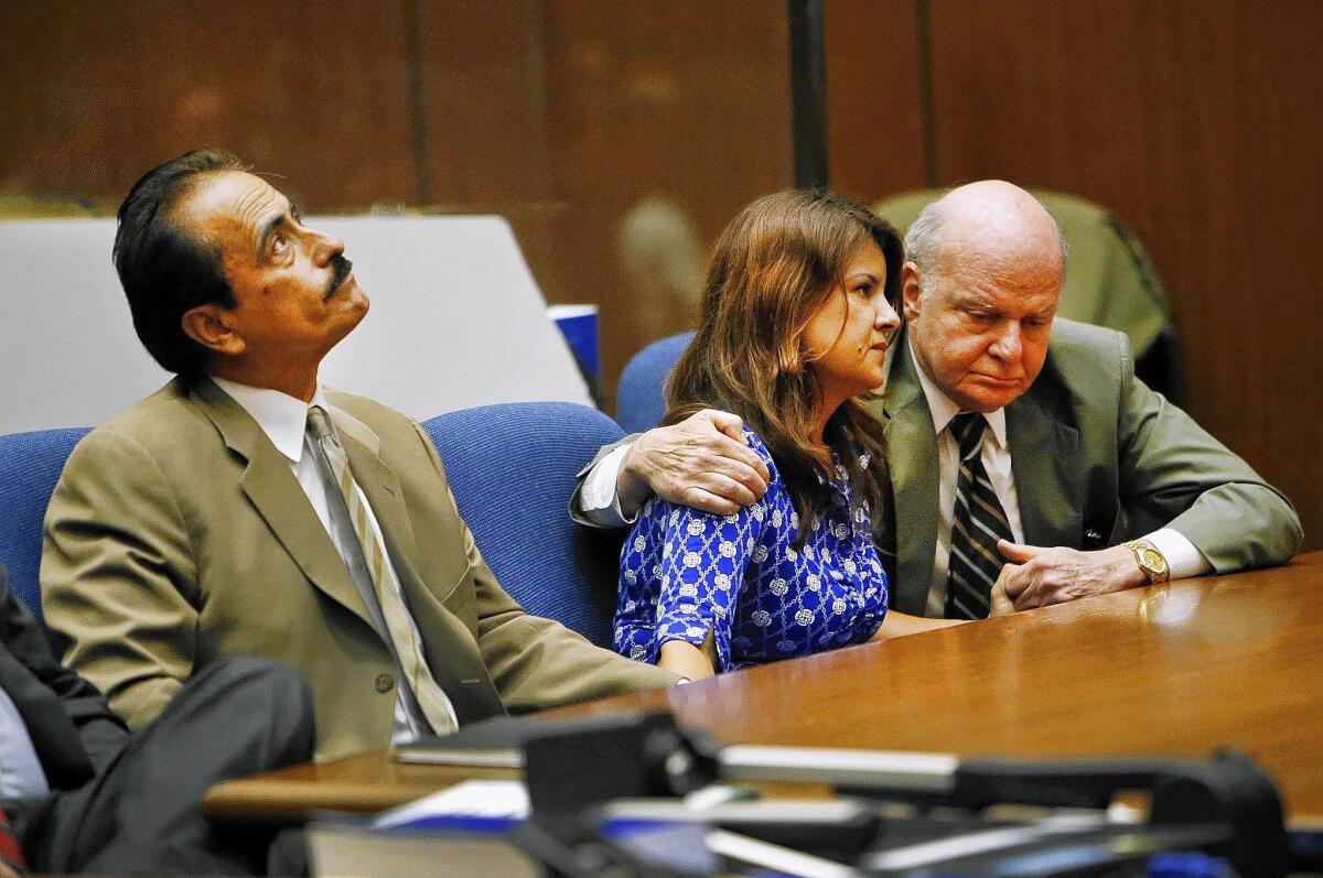 Former L.A. City Councilman Richard Alarcon, left, and his wife, Flora Montes de Oca Alarcon, with her attorney as the verdicts are read.