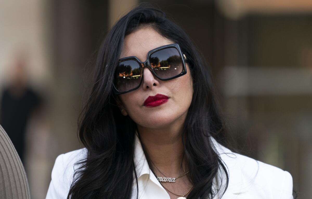 Vanessa Bryant is wearing sunglasses while she leaves a federal courthouse in Los Angeles. 
