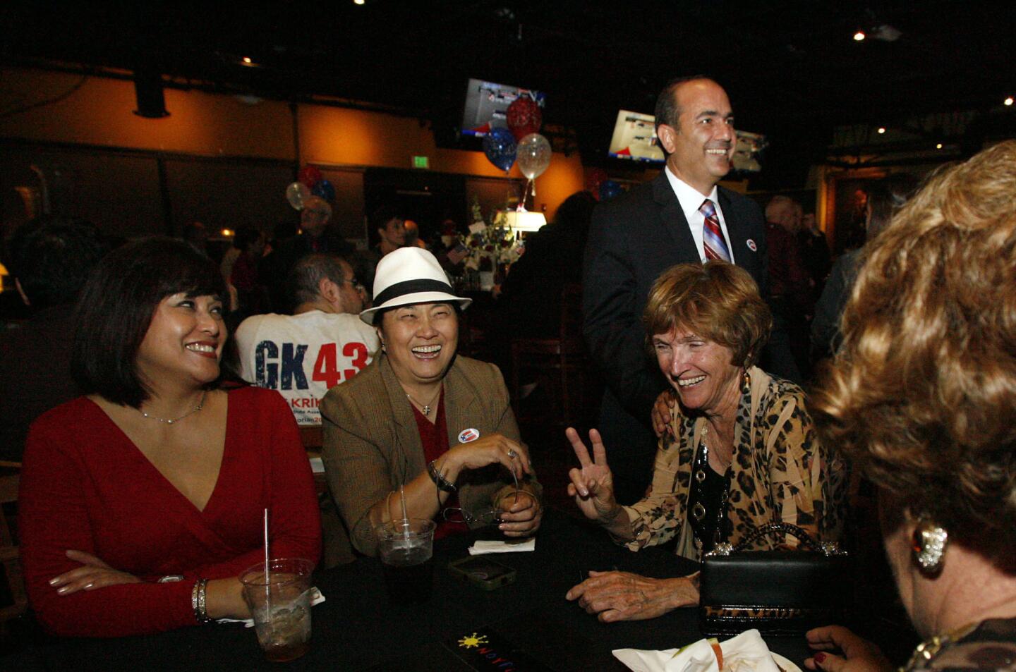 Supporters Arleen Penaflor, from left, Edith Fuentes and Cathy Zappala, second right, are greeted by State Assembly candidate Greg Krikorian on election night, which took place at Noypitz restaurant in Glendale on Tuesday, November 6, 2012.