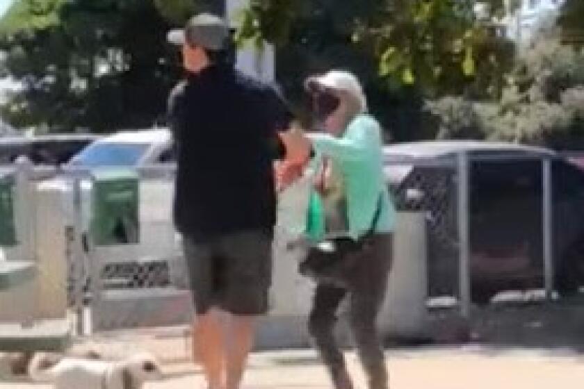 A still image from video shows a man apparently being maced or pepper-sprayed at Dusty Rhodes Dog Park in Ocean Beach.