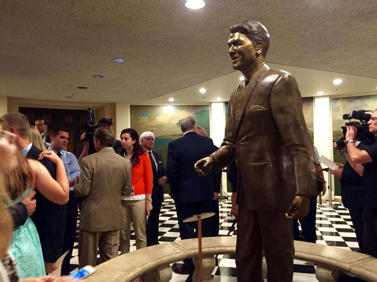 An 8-foot tall, 800-pound bronze statue of Ronald Reagan, the former California governor and U.S. president, is unveiled in the California Capitol on Monday.