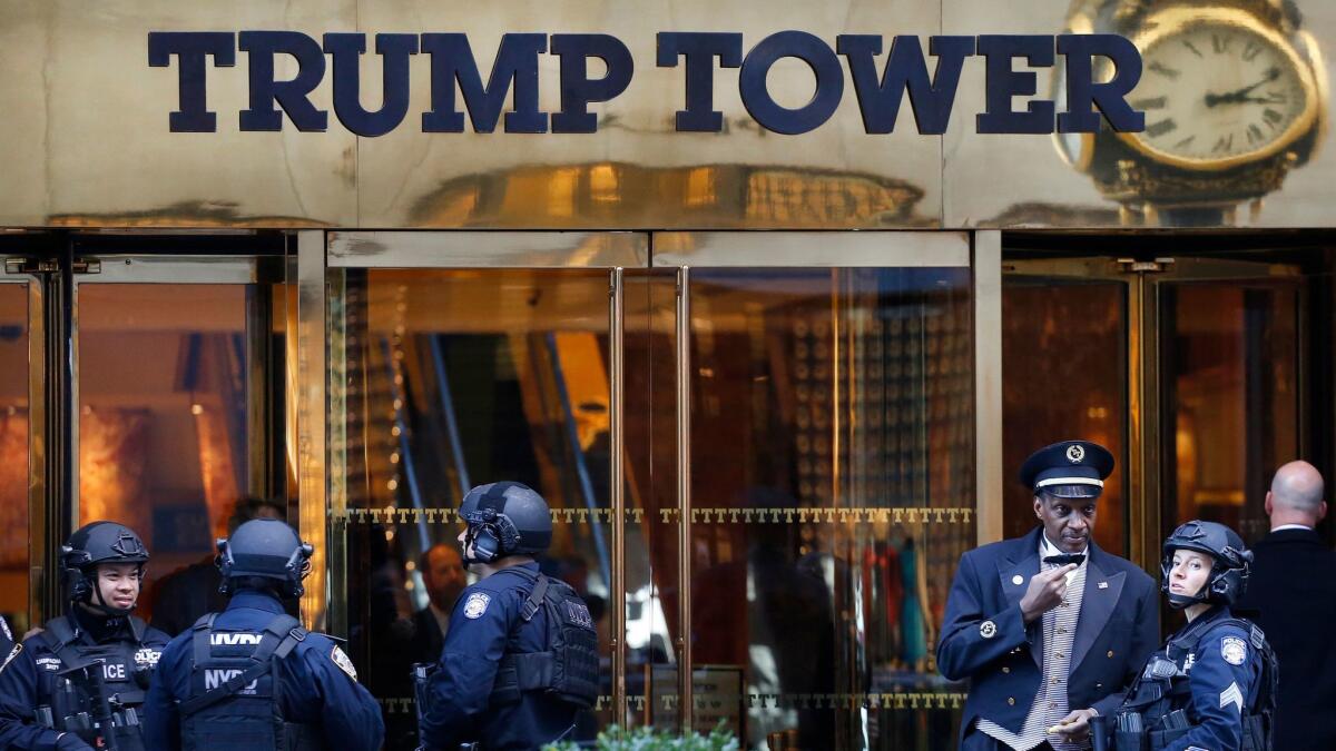 NYPD counterterrorism officers guard Trump Tower in New York last November. A lawsuit by a nonpartisan nonprofit alleges President Trump's business dealings overseas violate the U.S. Constitution.