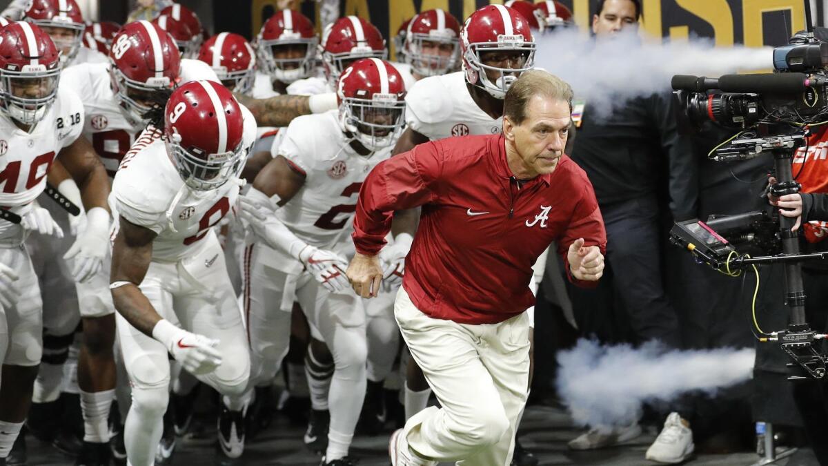 Nick Saban leads Alabama onto the field before the 2018 national championship game.