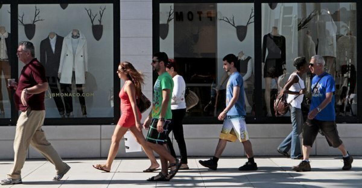 Shoppers bought more at stores in October compared to a year earlier, a report says.