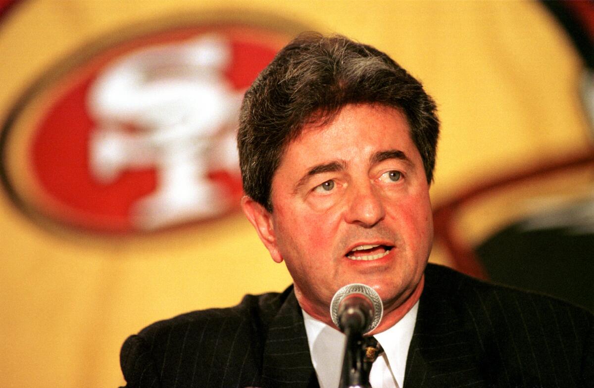 San Francisco 49ers executive Carmen Polic spreaks at a news conference in 1987.