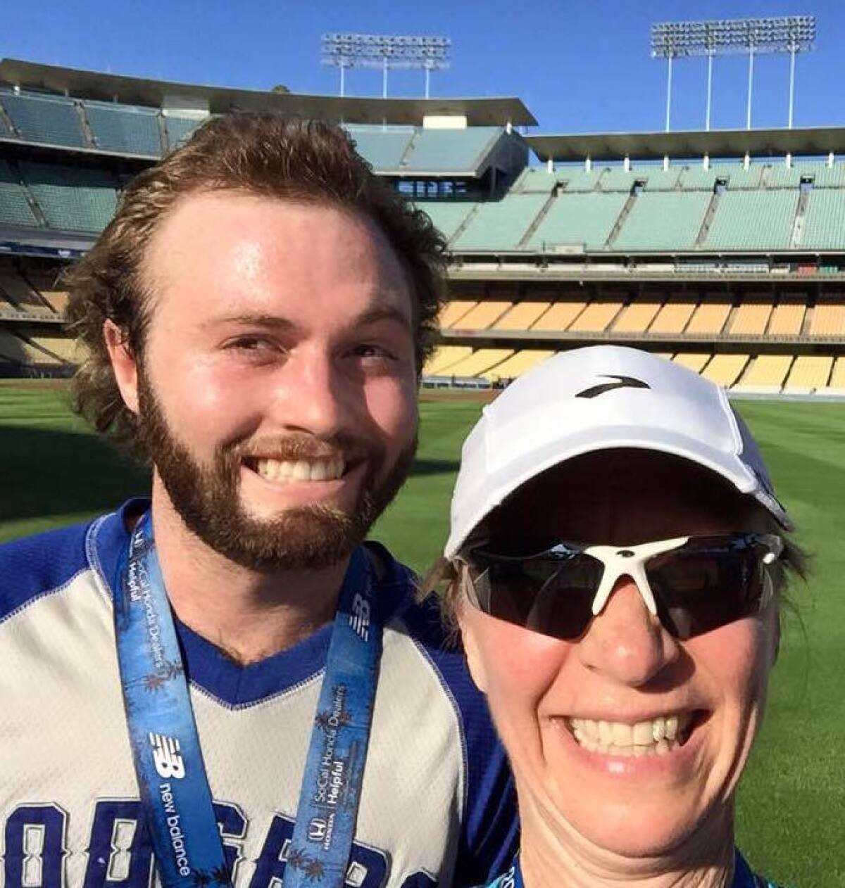 Benjamin David Hillman poses with his mother, Nadia Lindstrom Hillman, after completing the Dodgers 10K run.