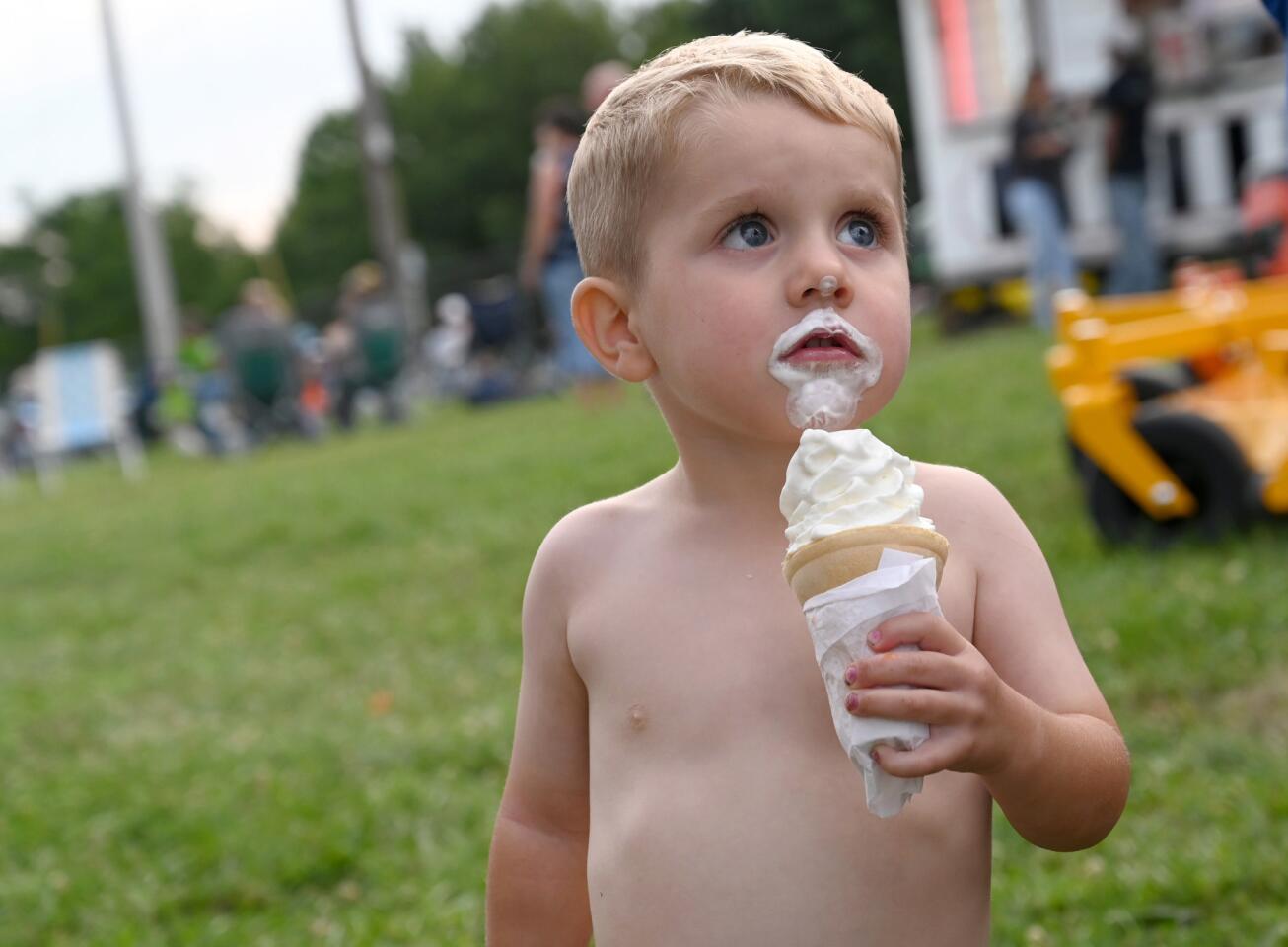 Brooks Turner, 2, of Mount Airy indulges in a soft serve ice cream at the Mount Airy Volunteer Fire Company's annual carnival on Tuesday, July 23.