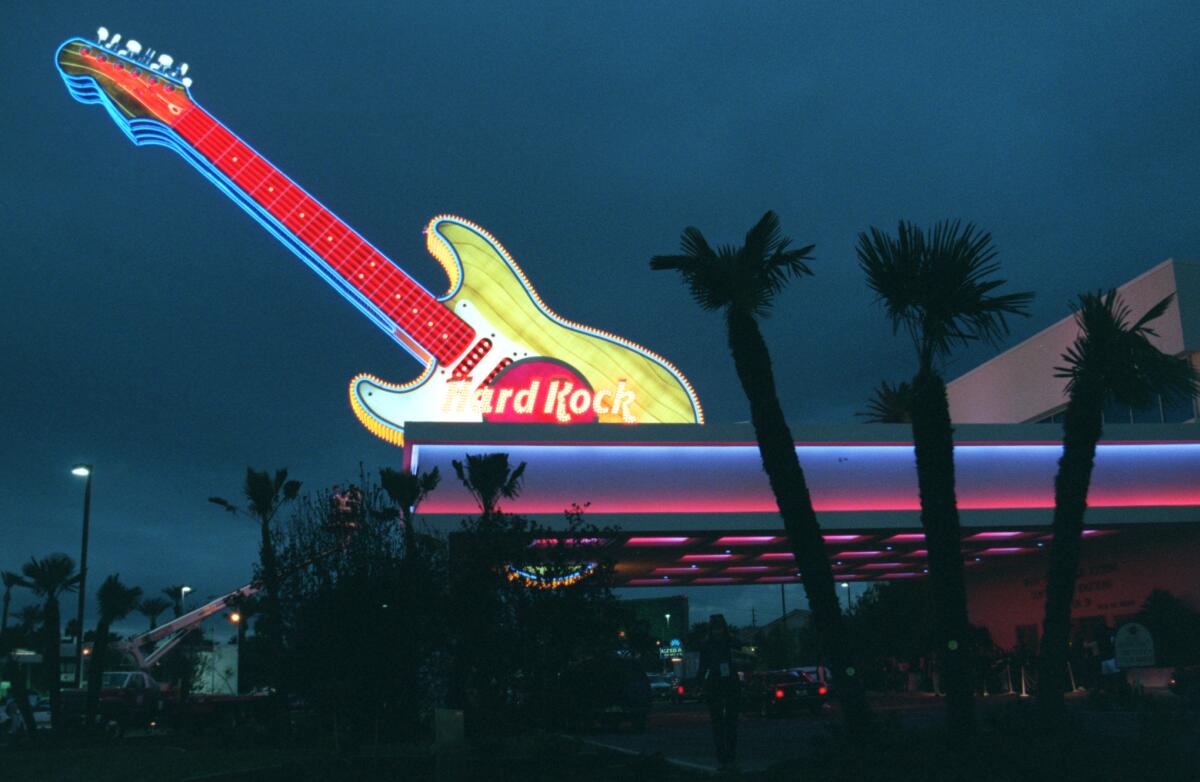 A sign in the shape of a giant guitar rises from the roof of the Hard Rock Hotel and Casino in Las Vegas.