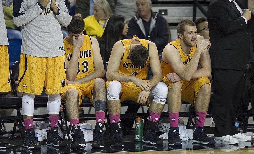 UC Irvine's Mike Best, left, Travis Souza and John Ryan show their disspaointment after losing to Hawaii 90-86 in overtime on Saturday.