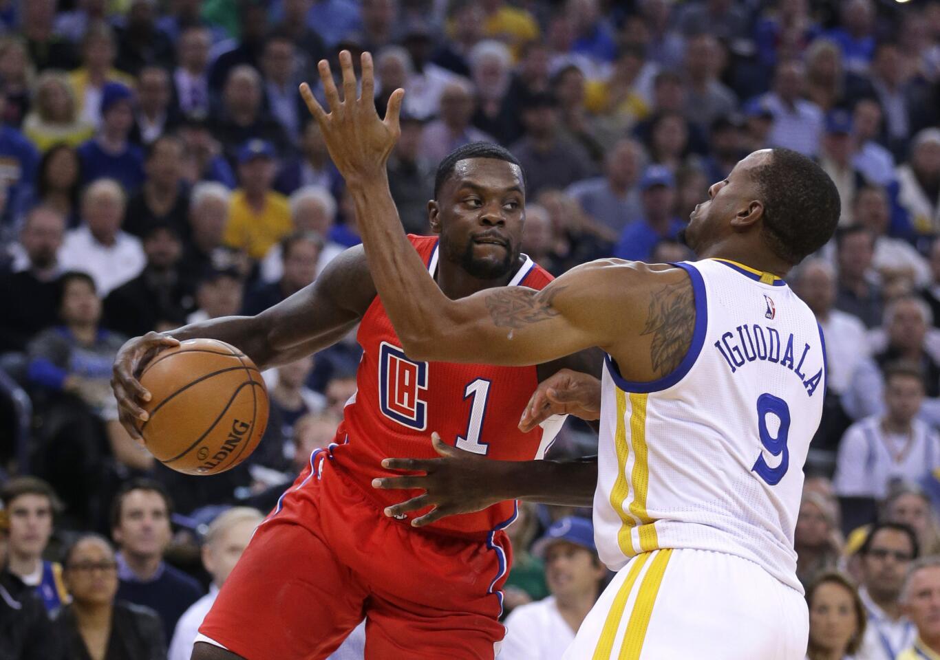 Clippers guard Lance Stephenson drives to the basket against Warriors forward Andre Iguodala in the first half.