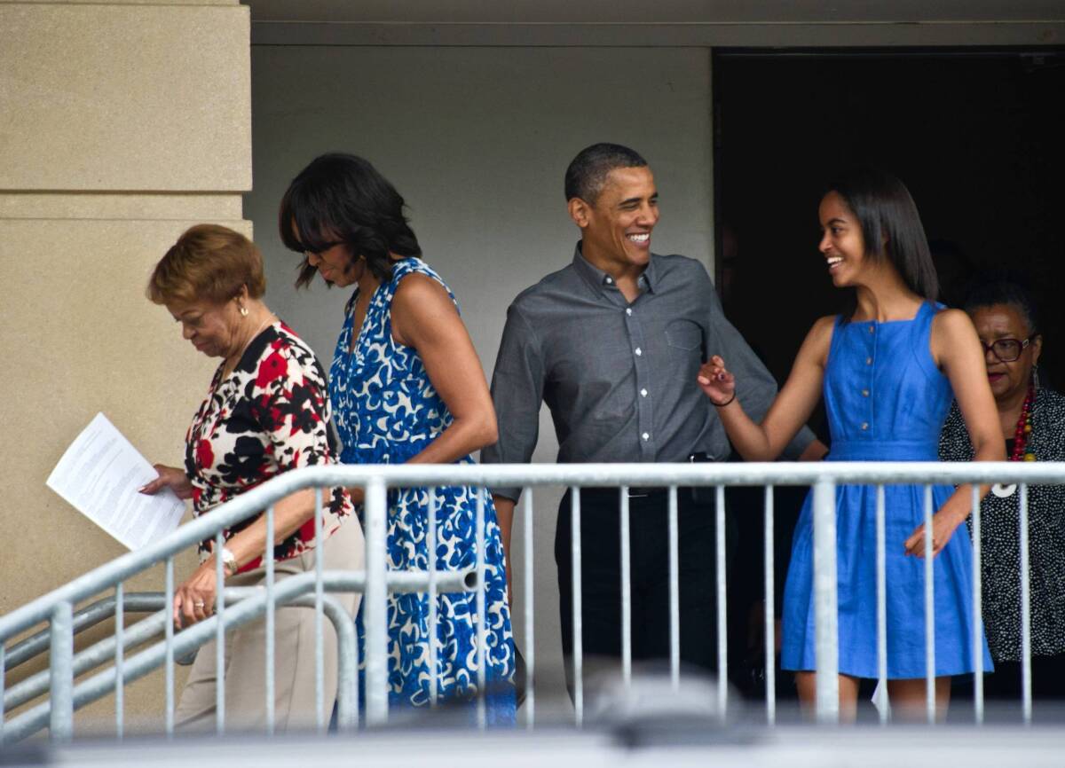 President Obama — along with mother-in-law Marian Robinson, left, wife Michelle and daughter Malia — leaves Strathmore Music Center in Bethesda, Md., after younger daughter Sasha’s dance recital. Obama is to attend the Group of 8 summit this week in Northern Ireland, then head to Germany.
