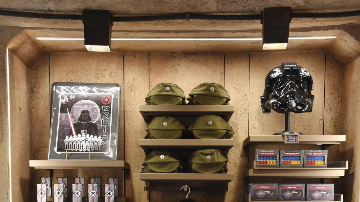 "Star Wars"-themed apparel is displayed inside the Dok-Ondar's Den of Antiquities store during the Star Wars: Galaxy's Edge media preview at Disneyland. Don't try to wear that Darth Vader helmet in the park.
