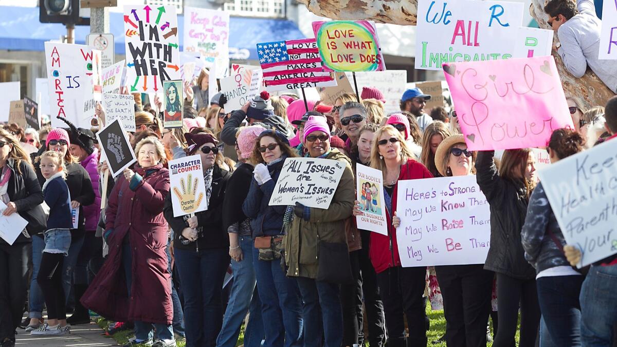 Hundreds of demonstrators lined South Coast Highway in the Laguna Beach Women’s March at Main Beach on Jan. 21, 2017.