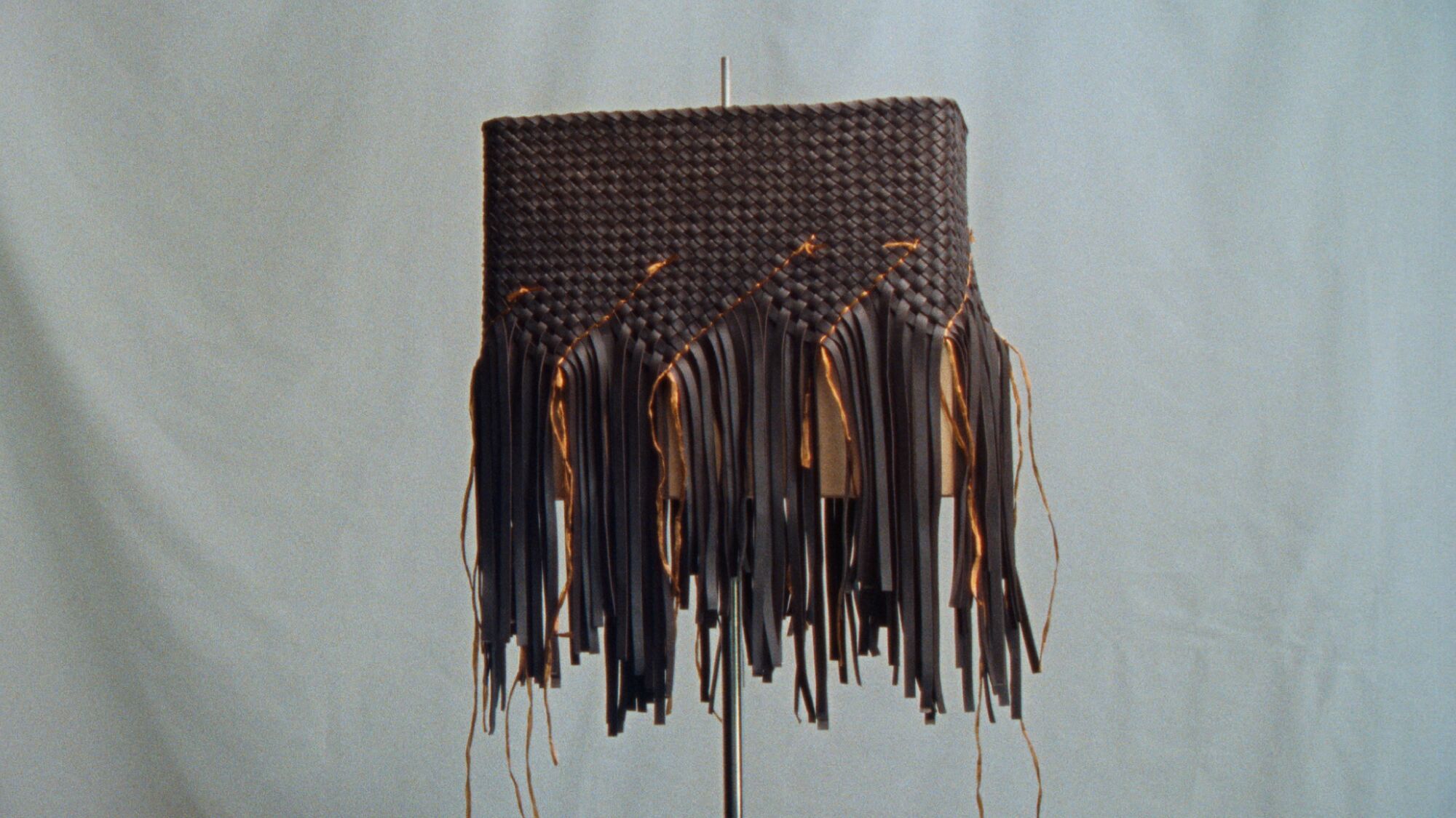 A shape made of strands of woven leather