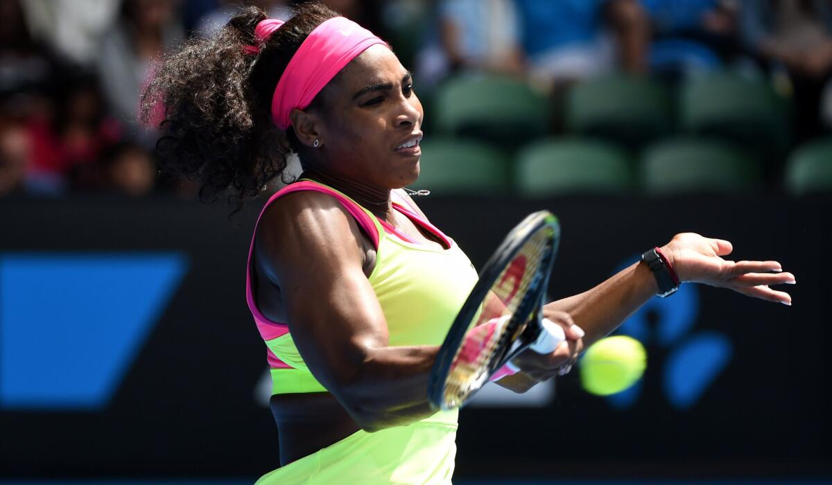 Serena Williams hits a forehard during her match against Garbine Muguruza in a fourth-round match at the Australian Open on Monday.