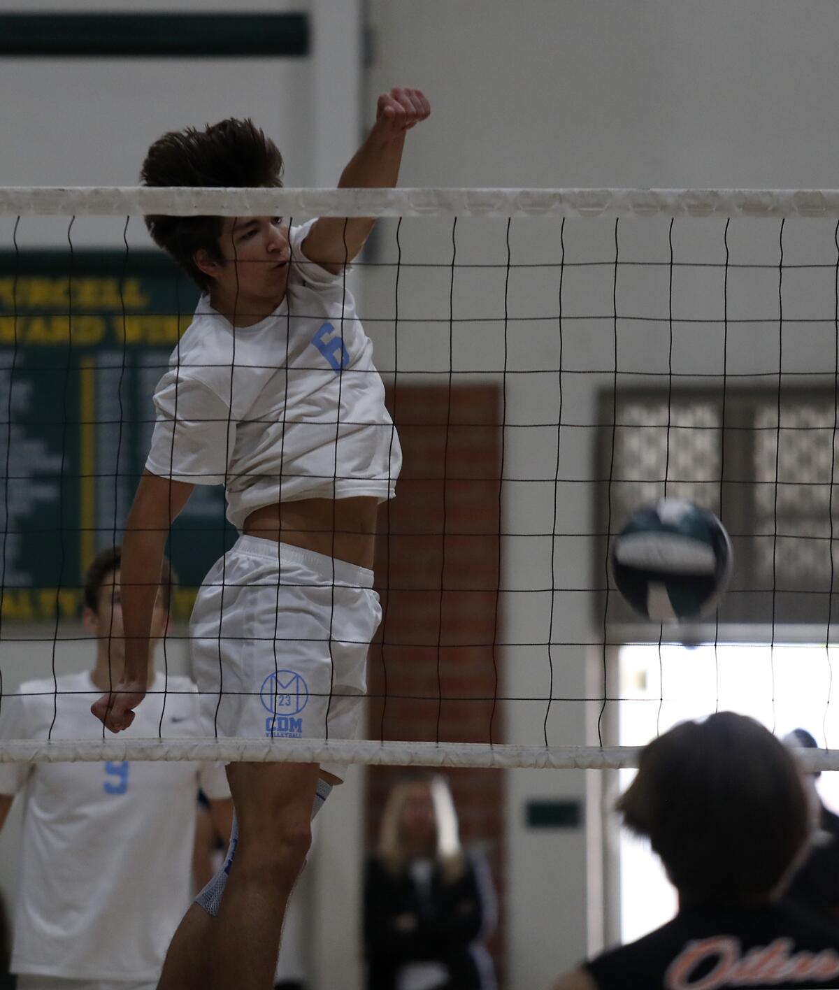 Corona del Mar's Bryce Dvorak scores against Huntington Beach in the first set of an Orange County Championships boys' volleyball tournament semifinal match at Edison High on Saturday.