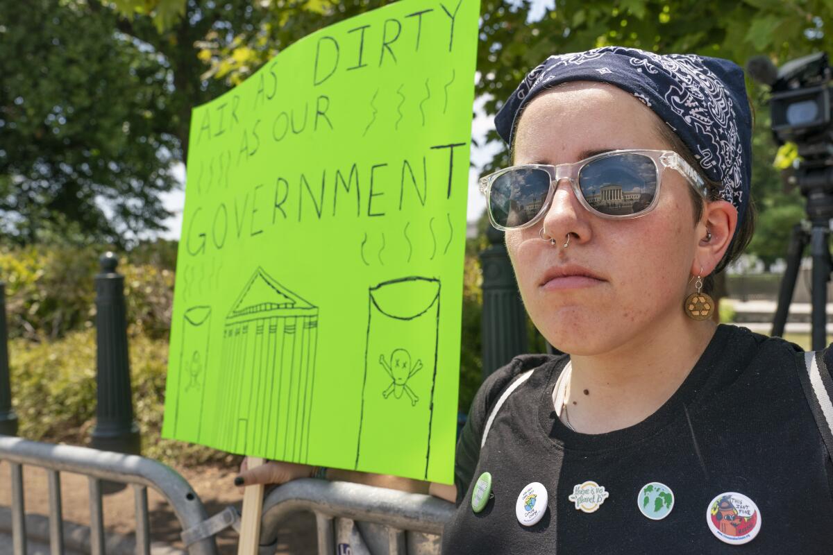 Erin Tinerella, of Chicago,  protests against climate change after the Supreme Court's EPA decision.