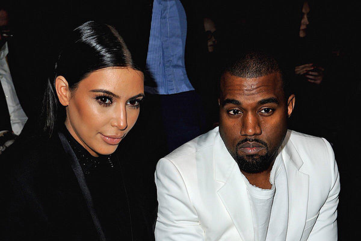 Kim Kardashian and Kanye West, shown earlier this month at Paris Fashion Week, are among the high-profile people whose personal and financial information has been hacked and posted online.