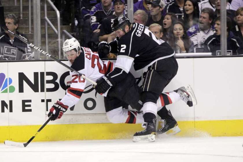 Kings defenseman Matt Greene and New Jersey Devils center Ryan Carter collide during Game 6 of the 2012 Stanley Cup Finals.