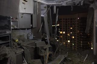 A damaged apartment is seen in Kyiv, Ukraine, Thursday, July 13, 2023, following Russia's air attacks targeting the capital city. (AP Photo/Jae C. Hong)
