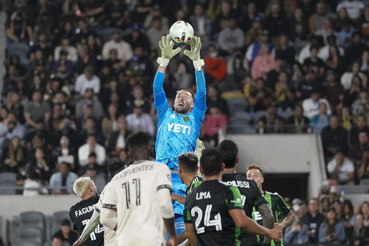 Austin FC goalkeeper Brad Stuver tries to grab the ball during a match against LAFC on May 18.