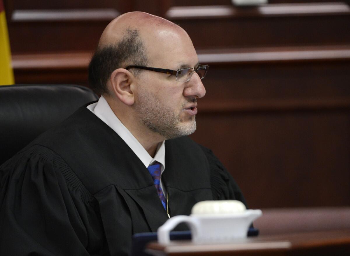 Judge Carlos A. Samour Jr., seen here during an April hearing for Aurora, Colo., theater shooting suspect James Holmes in Centennial, Colo.