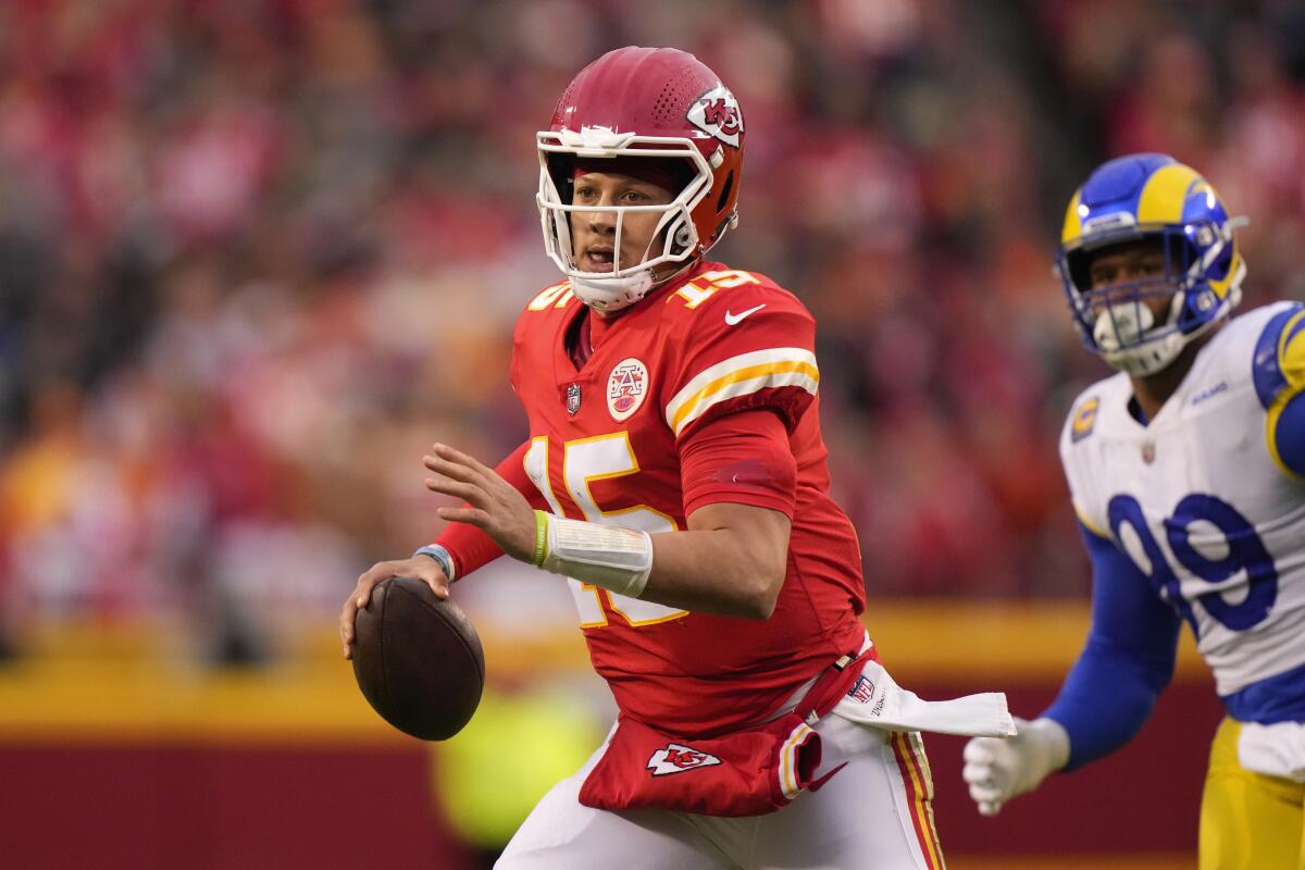 Kansas City Chiefs quarterback Patrick Mahomes looks to pass during the first half against the Rams.