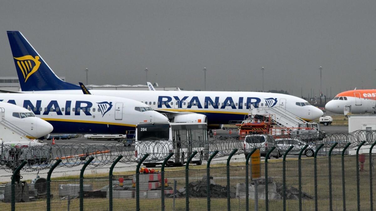 Planes of Irish airline Ryanair stand on the tarmac.