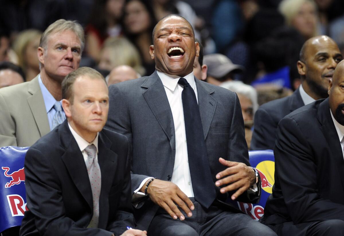 Clippers Coach Doc Rivers laughs on the bench during a 2015 game against the Celtics at Staples Center. The Clippers beat the Celtics, 102-93.