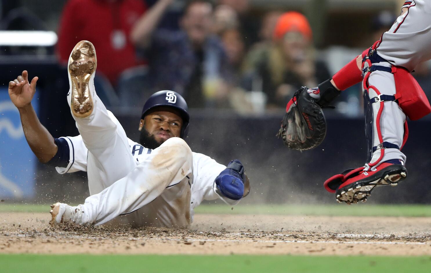 From left, Atlanta Braves catcher Tyler Flowers, left, shortstop