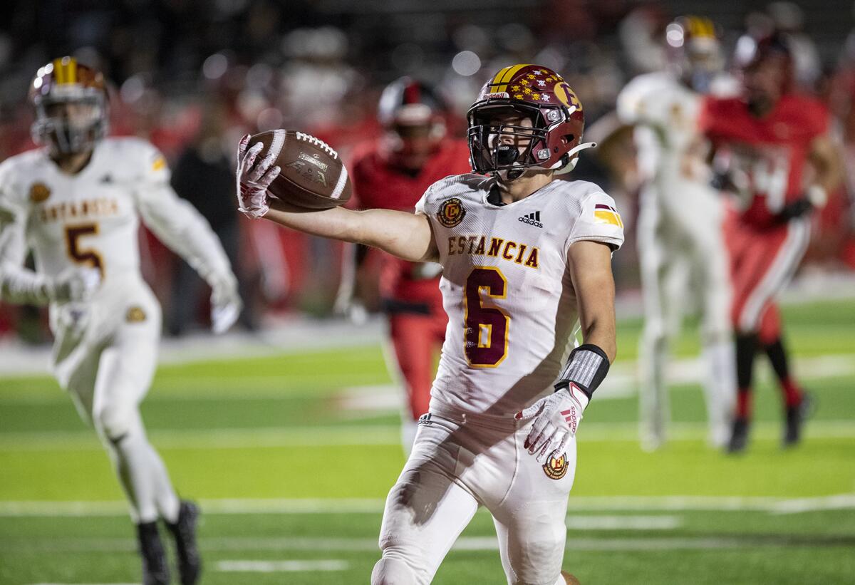 Estancia's Noah Aires celebrates after scoring a touchdown in the first half of nonleague game against Artesia on Thursday.