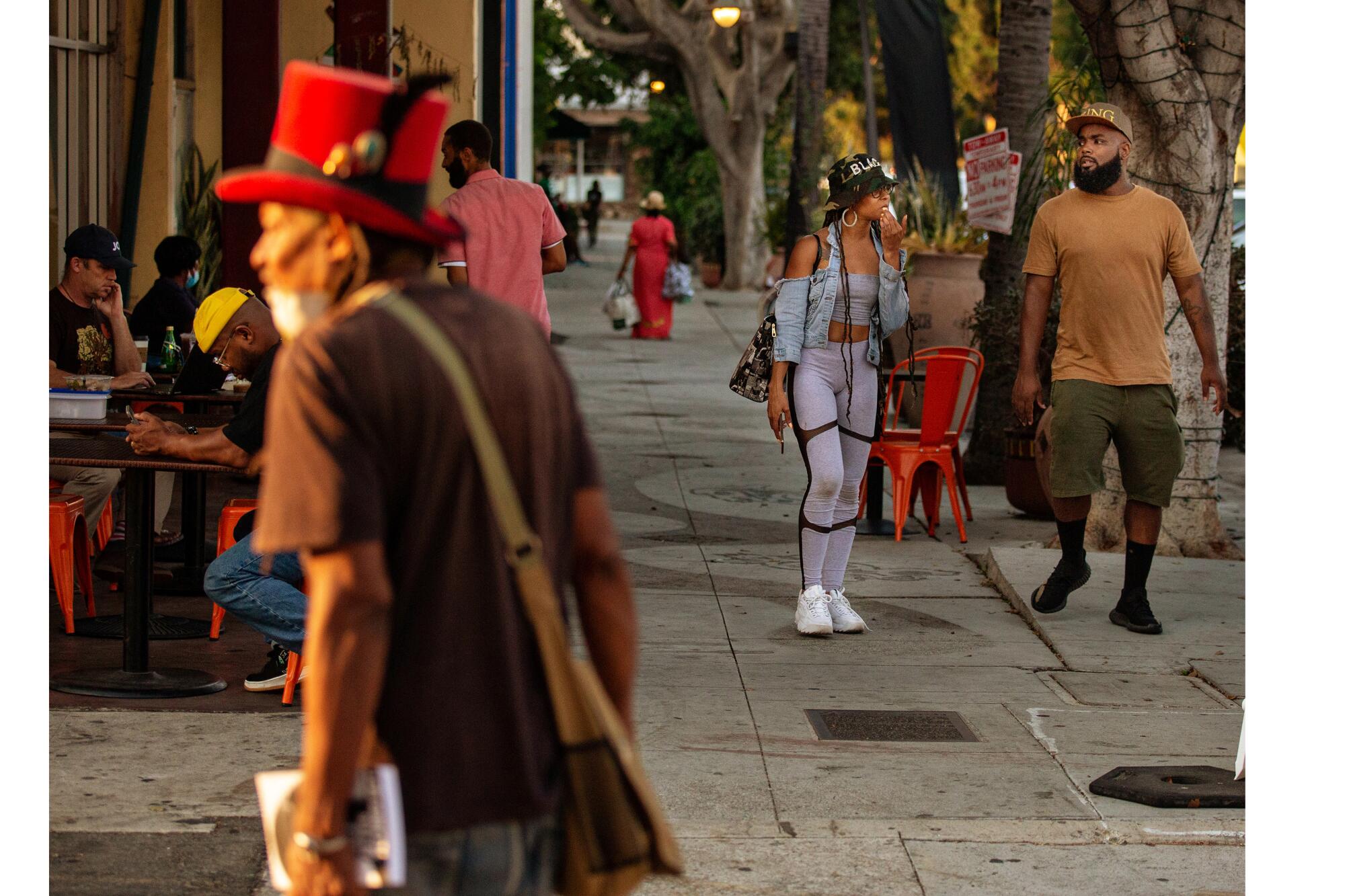 People enjoy an evening in Leimert Park