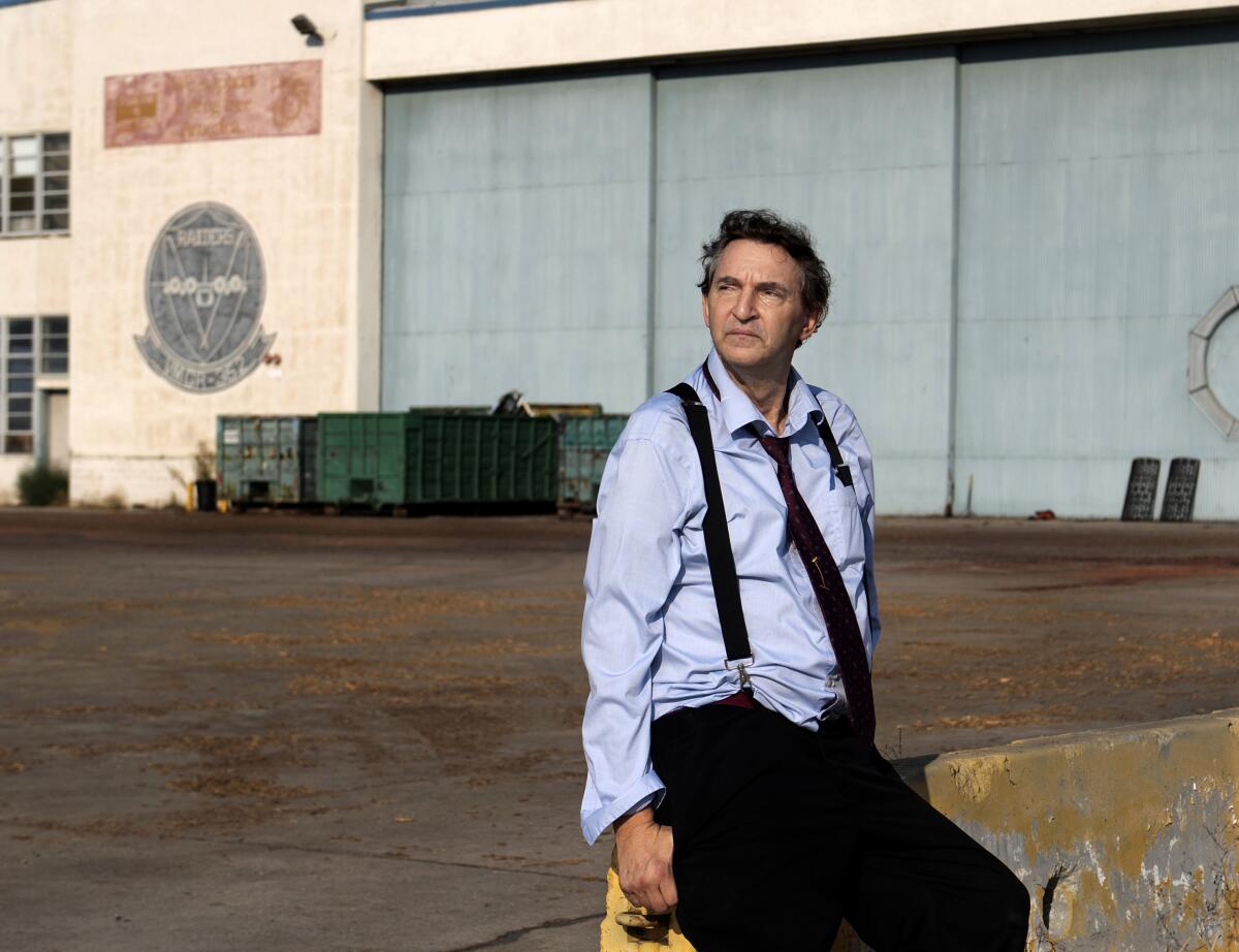 Bill Alkofer sits outside of Hangar 296 at the former El Toro Marine Base. 