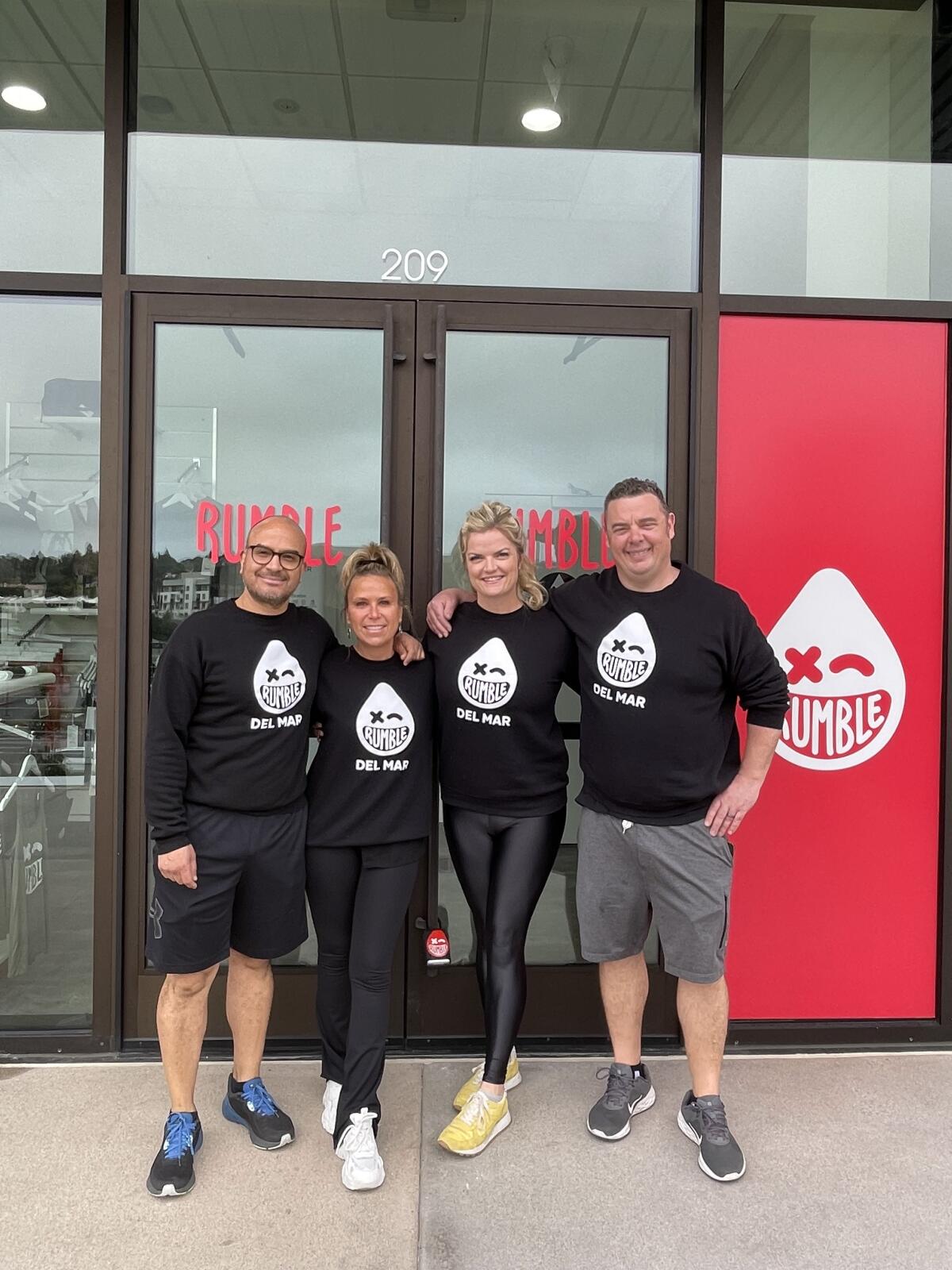 Rumble Boxing owners Fernando Hoyos, Maribel Ota, Megan Hughes and Carl Hughes.