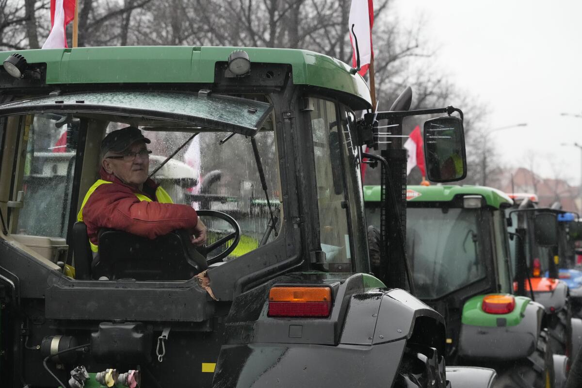 Polish farmers driving their heavy-duty tractors during a protest