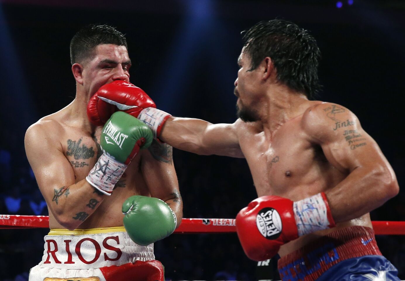 Manny Pacquiao lands a right to the face of Brandon Rios during their WBO international welterweight title fight on Sunday in Macao.